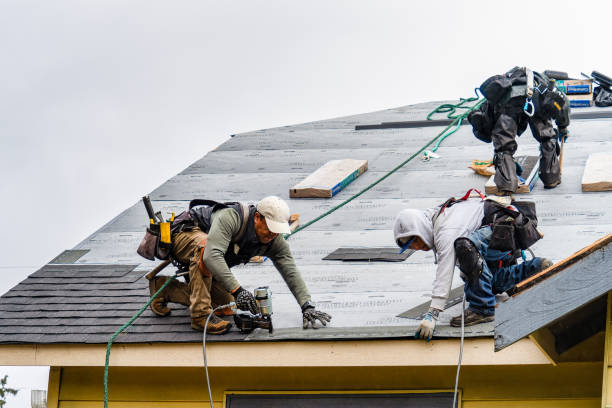 Professional Roofing technician working in Carle Place, NY